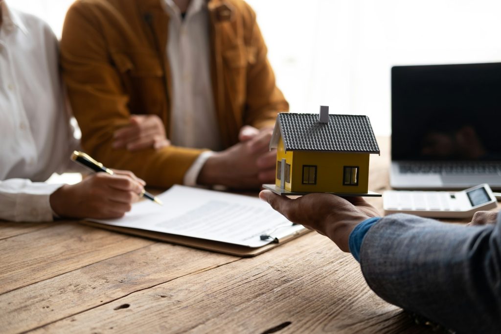 Mortgage and real estate property investment concept. Real estate agent explain terms and condition